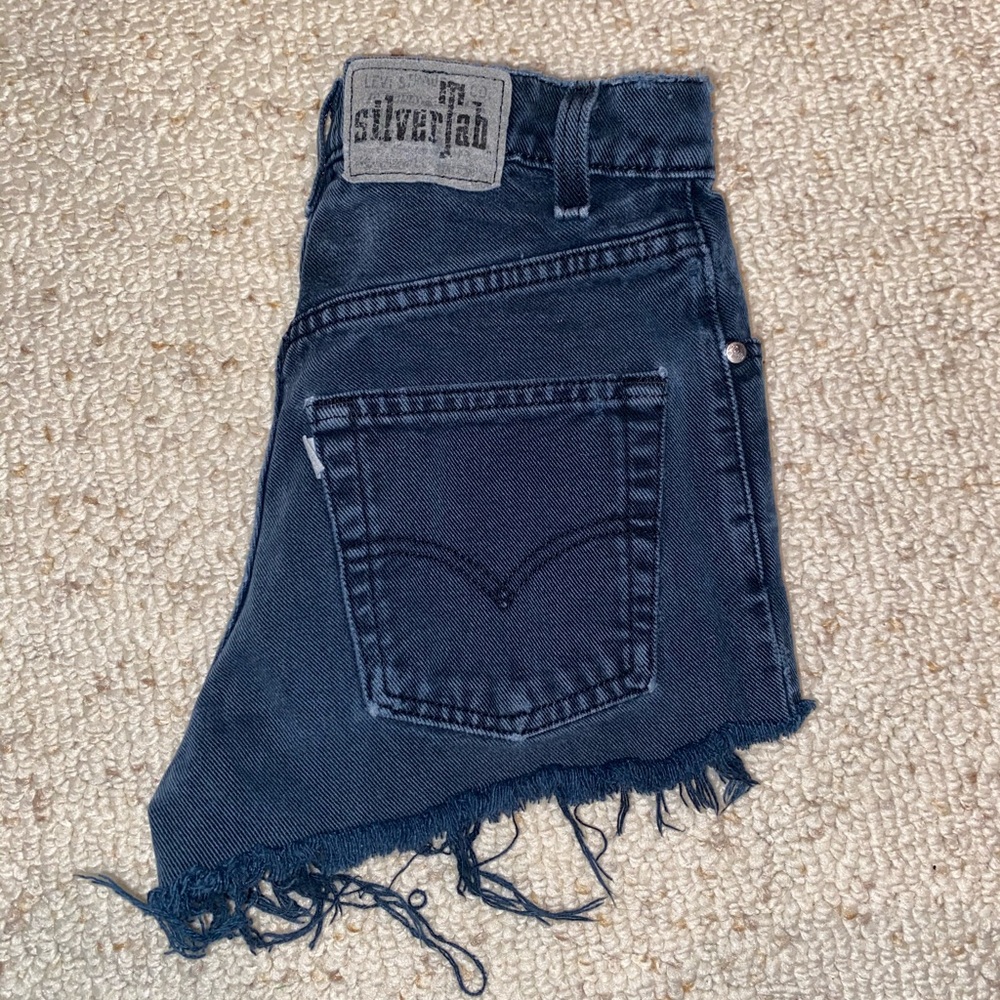 Distressed blue jean shorts